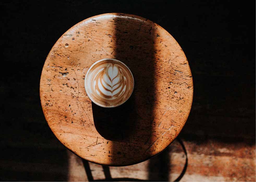 Latte sitting on a coffeehouse table